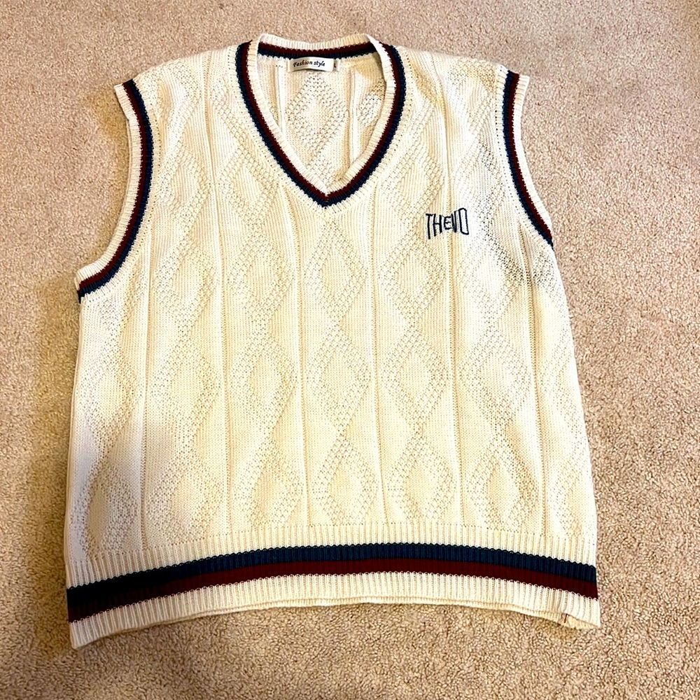 An oversized vest with stripes along edges